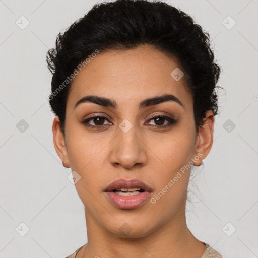 Joyful latino young-adult female with short  black hair and brown eyes