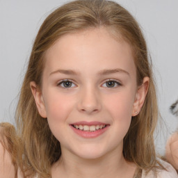 Joyful white child female with medium  brown hair and brown eyes