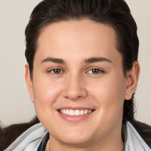 Joyful white young-adult female with medium  brown hair and brown eyes