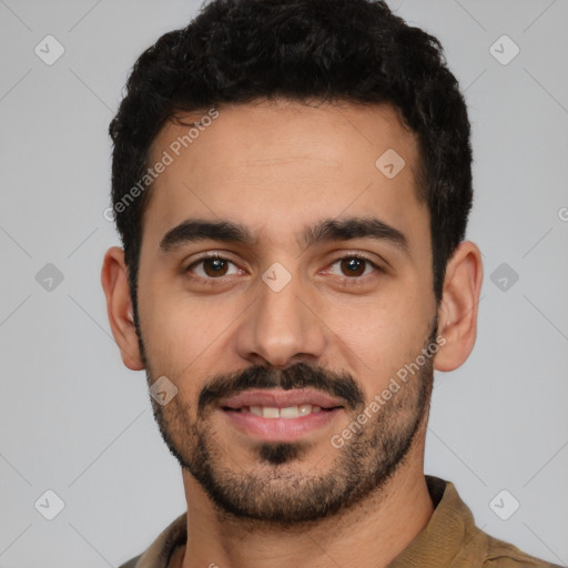 Joyful latino young-adult male with short  black hair and brown eyes