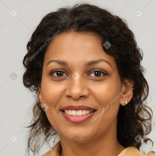 Joyful black adult female with medium  brown hair and brown eyes