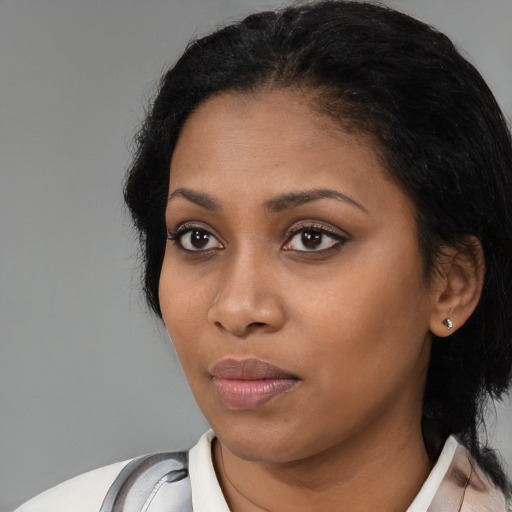 Neutral black young-adult female with medium  black hair and brown eyes