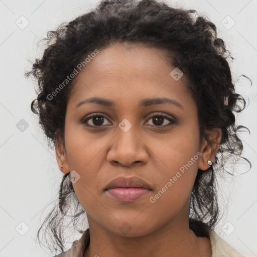 Joyful black young-adult female with long  brown hair and brown eyes