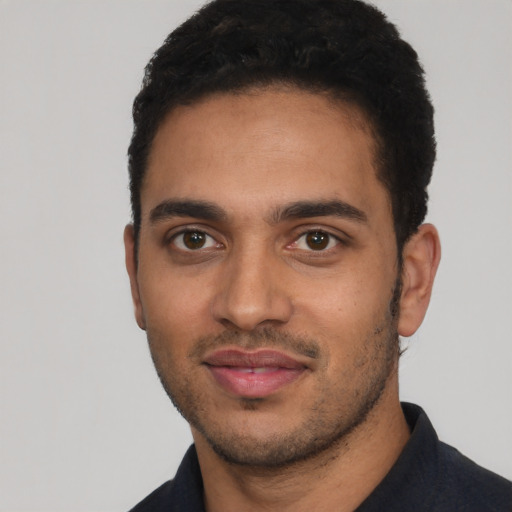 Neutral latino young-adult male with short  black hair and brown eyes