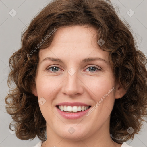 Joyful white young-adult female with medium  brown hair and green eyes