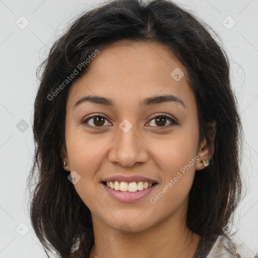 Joyful latino young-adult female with long  brown hair and brown eyes