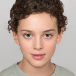 Joyful white child female with short  brown hair and brown eyes