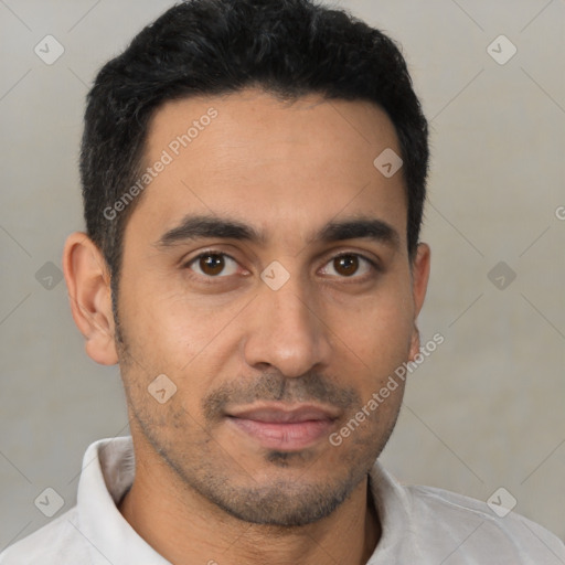 Joyful latino young-adult male with short  brown hair and brown eyes