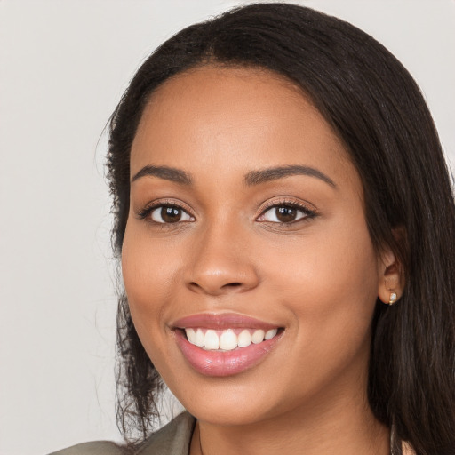 Joyful white young-adult female with long  black hair and brown eyes