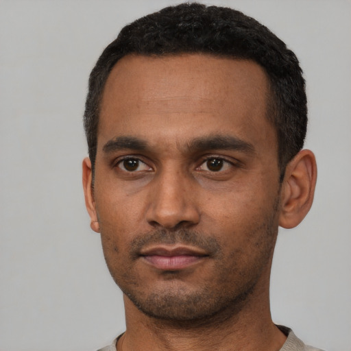 Neutral latino young-adult male with short  black hair and brown eyes