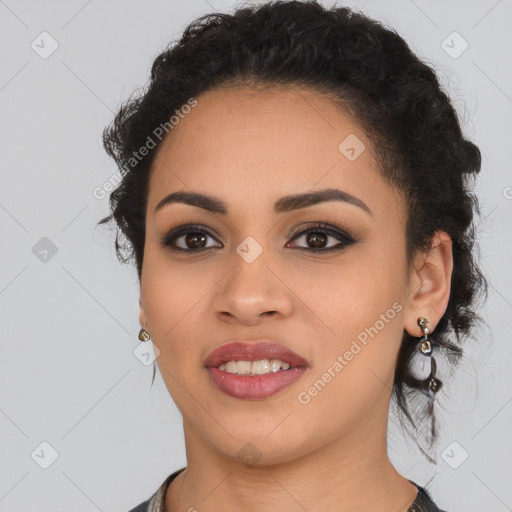 Joyful latino young-adult female with long  brown hair and brown eyes