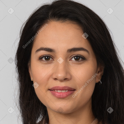 Joyful latino young-adult female with long  brown hair and brown eyes