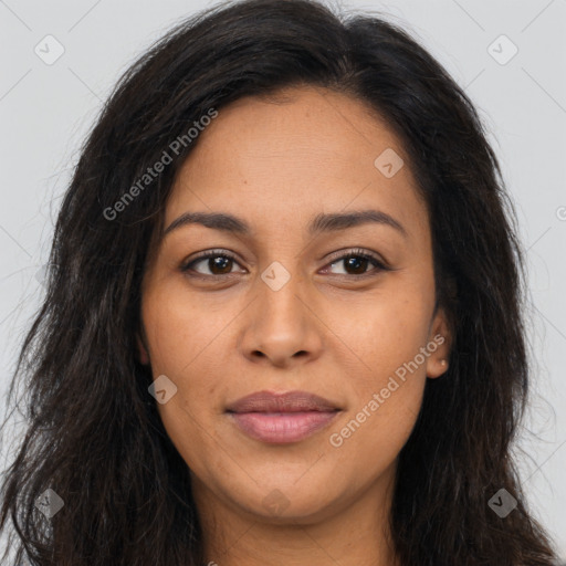 Joyful latino young-adult female with long  brown hair and brown eyes