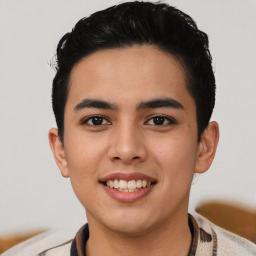 Joyful latino young-adult male with short  black hair and brown eyes