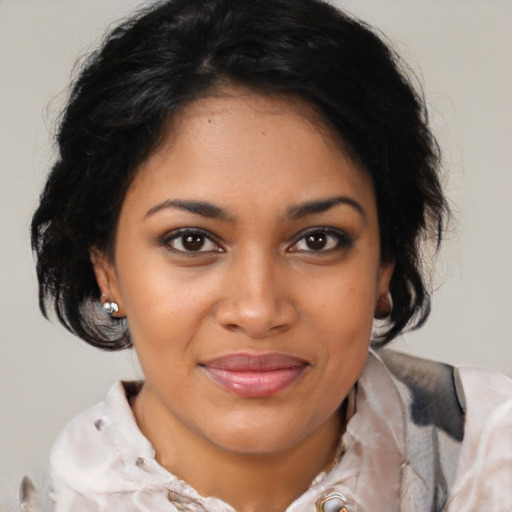 Joyful black young-adult female with medium  brown hair and brown eyes
