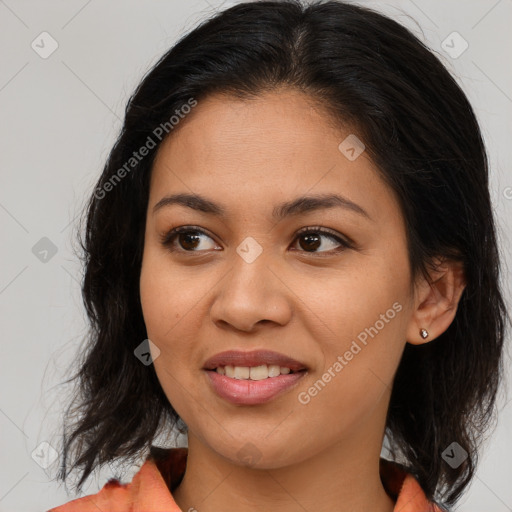 Joyful latino young-adult female with medium  brown hair and brown eyes