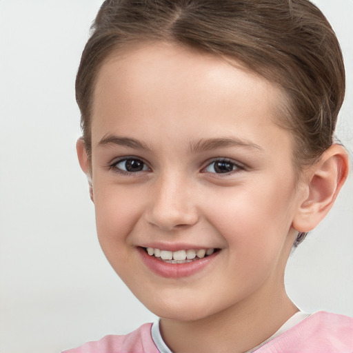 Joyful white child female with short  brown hair and brown eyes