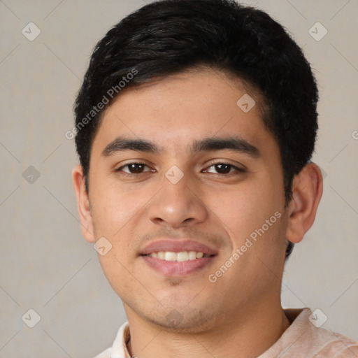 Joyful latino young-adult male with short  brown hair and brown eyes