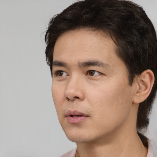 Neutral white young-adult male with short  black hair and brown eyes