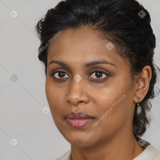 Joyful black young-adult female with medium  brown hair and brown eyes