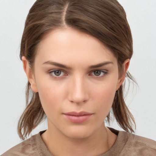 Neutral white young-adult female with medium  brown hair and brown eyes