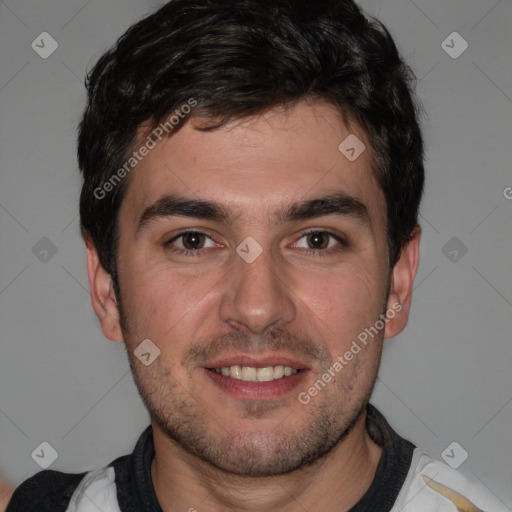Joyful white young-adult male with short  black hair and brown eyes