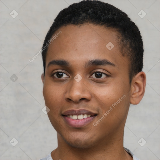 Joyful black young-adult male with short  black hair and brown eyes