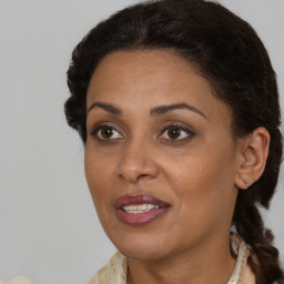 Joyful black young-adult female with medium  brown hair and brown eyes