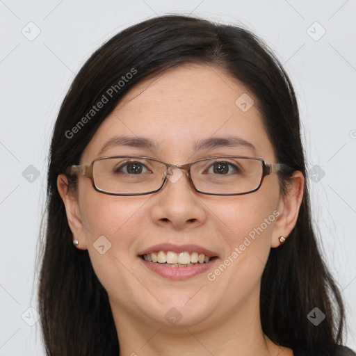 Joyful white adult female with long  brown hair and grey eyes