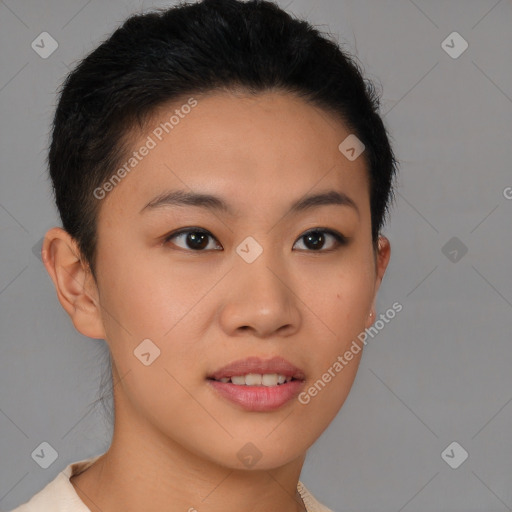 Joyful asian young-adult female with short  brown hair and brown eyes