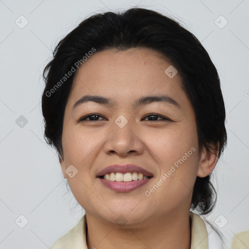 Joyful asian young-adult female with short  black hair and brown eyes