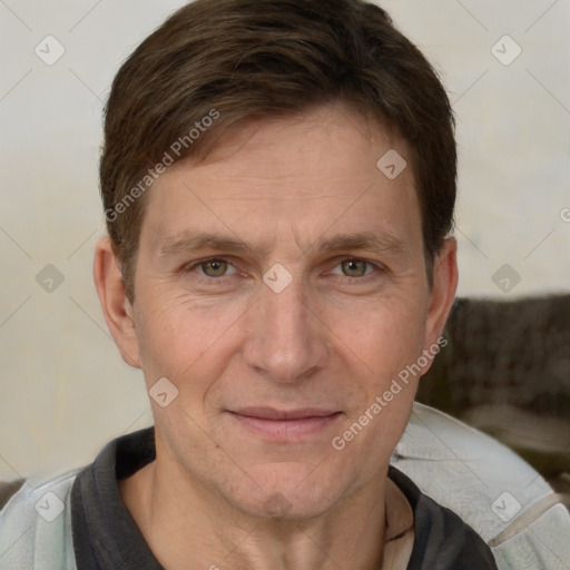 Joyful white adult male with short  brown hair and grey eyes