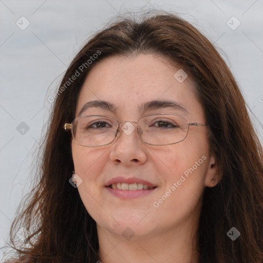 Joyful white adult female with long  brown hair and brown eyes