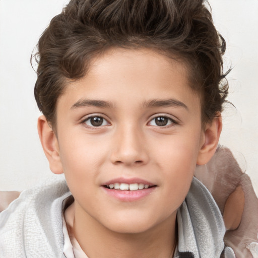 Joyful white child male with short  brown hair and brown eyes