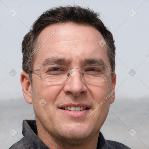 Joyful white adult male with short  brown hair and grey eyes