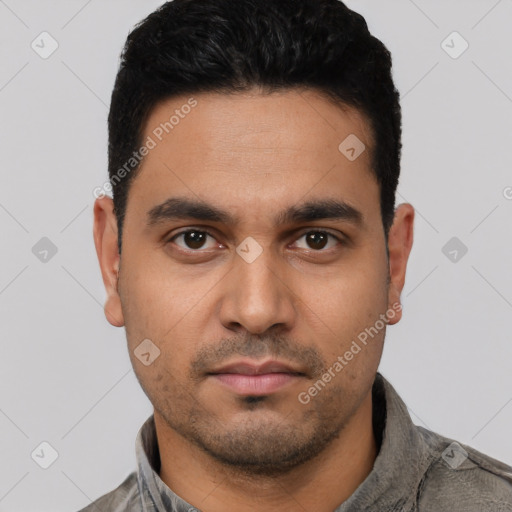 Neutral latino young-adult male with short  black hair and brown eyes