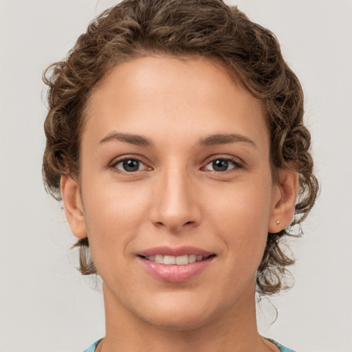 Joyful white young-adult female with medium  brown hair and green eyes