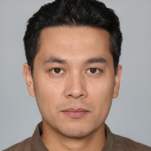 Neutral white young-adult male with short  black hair and brown eyes