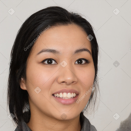 Joyful asian young-adult female with medium  black hair and brown eyes