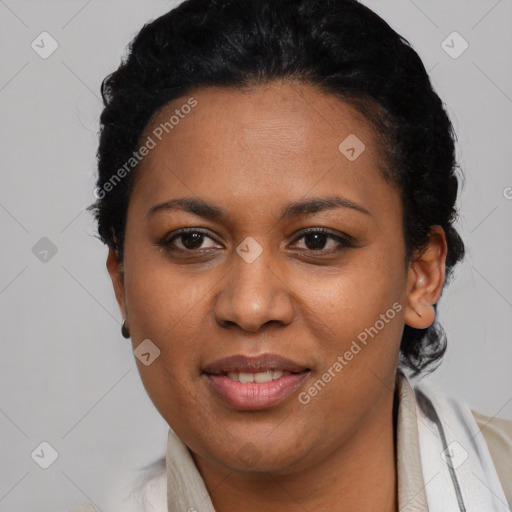 Joyful black young-adult female with short  black hair and brown eyes