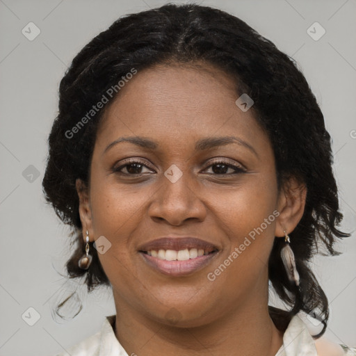 Joyful black young-adult female with medium  brown hair and brown eyes