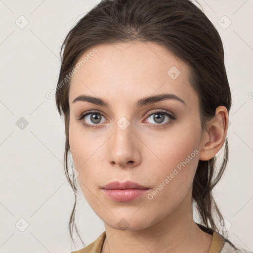 Neutral white young-adult female with medium  brown hair and grey eyes