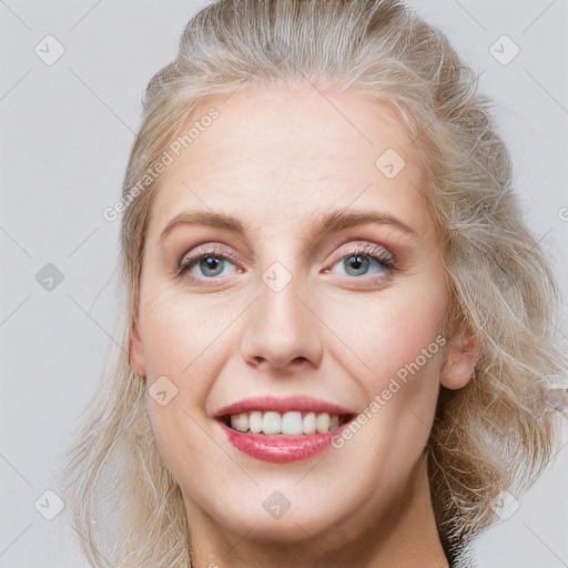 Joyful white young-adult female with medium  brown hair and blue eyes