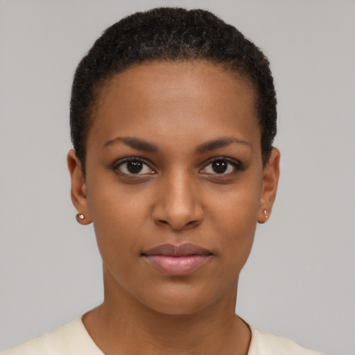 Joyful black young-adult female with short  brown hair and brown eyes
