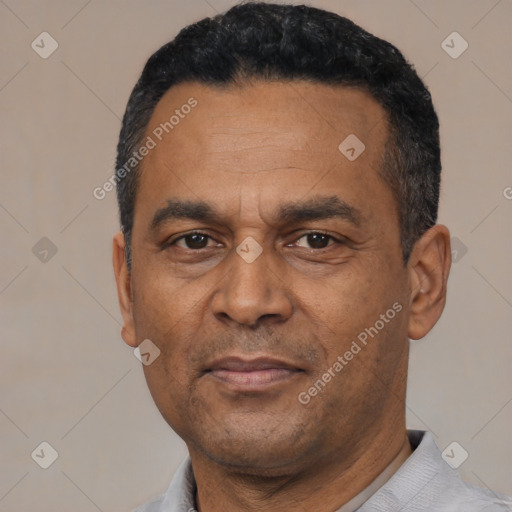 Neutral latino adult male with short  black hair and brown eyes