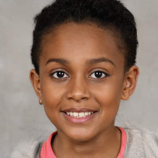 Joyful black child female with short  brown hair and brown eyes