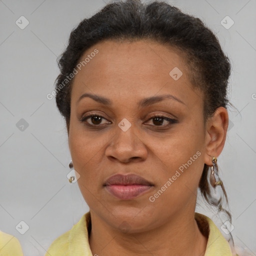 Joyful black adult female with short  brown hair and brown eyes