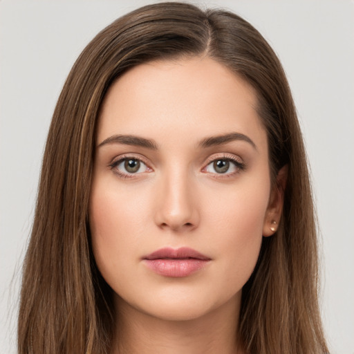 Neutral white young-adult female with long  brown hair and brown eyes