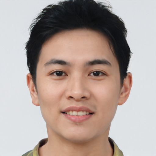 Joyful asian young-adult male with short  black hair and brown eyes