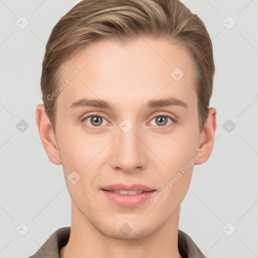 Joyful white young-adult male with short  brown hair and grey eyes